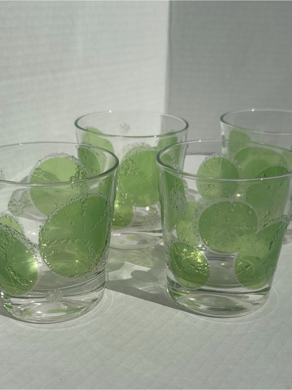Vintage single shot glasses set of 4 featuring a textured greenlime slice design